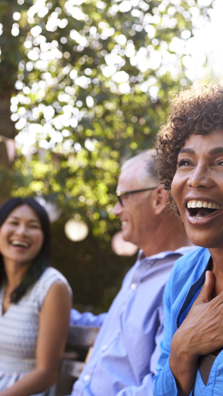 a group of people laughing and smiling at a party at The Soltera Rolling Pines