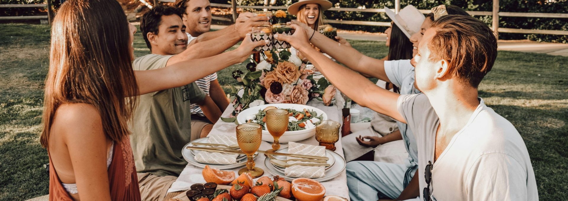 people sitting on chair eating food during daytime